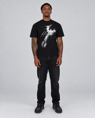 Full-body front view of a model wearing the black Fallen T-Shirt with black jeans and dark sneakers.