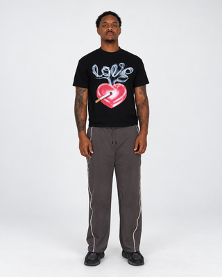 Model front wearing Slow Burn tee and Reflection Stripe Sweats