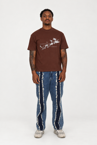 Somewhere Better T-Shirt in walnut brown with cream bird graphic, full-body front studio view.