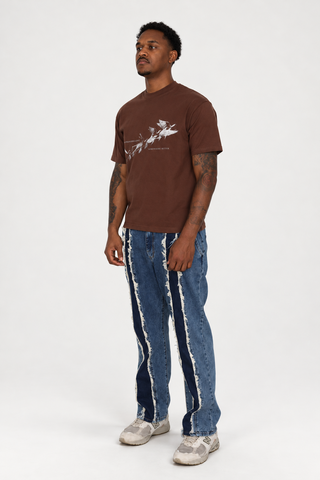 Somewhere Better T-Shirt in walnut brown with cream bird graphic, full-body left-facing three-quarter studio view.